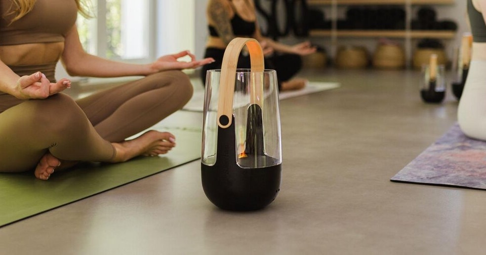 An air purifier on the floor of a yoga studio