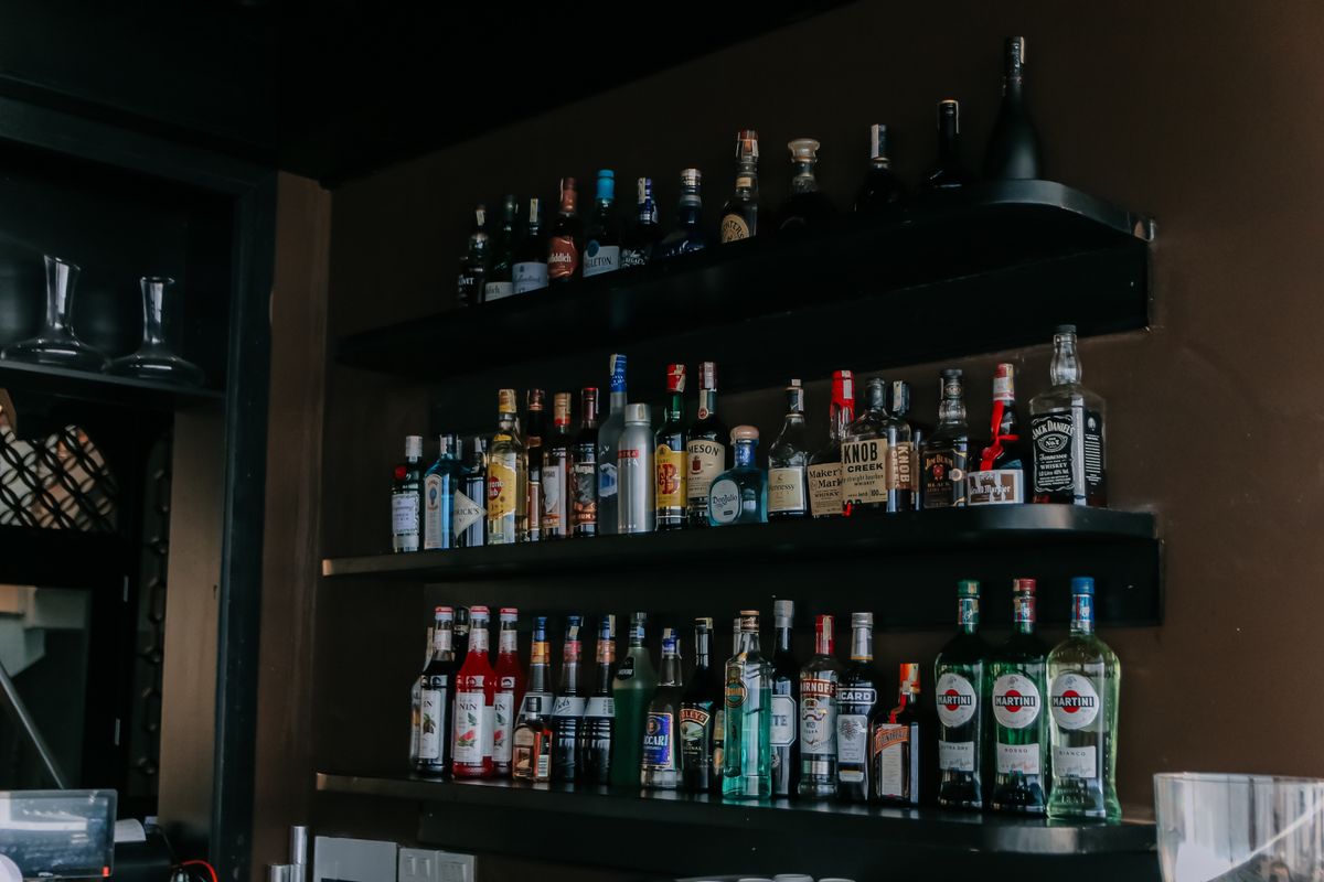 Liquor bottles on bar shelves