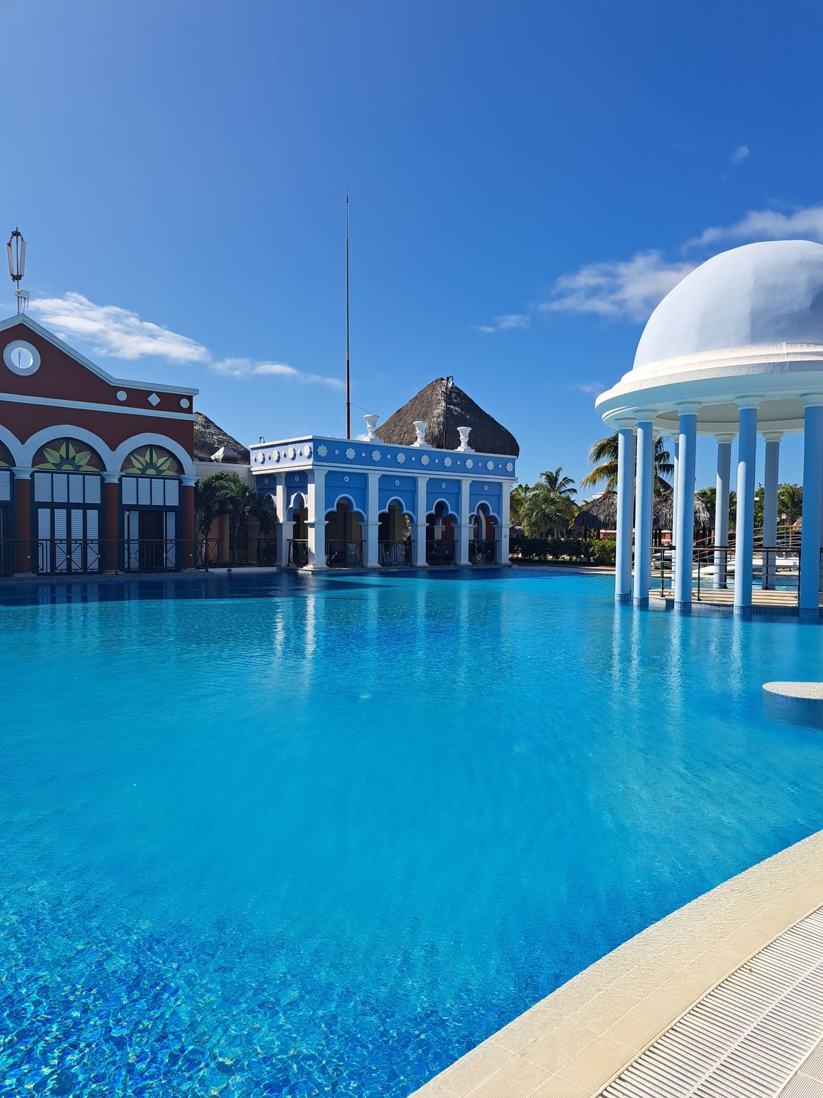 An elegant hotel pool with a rotunda