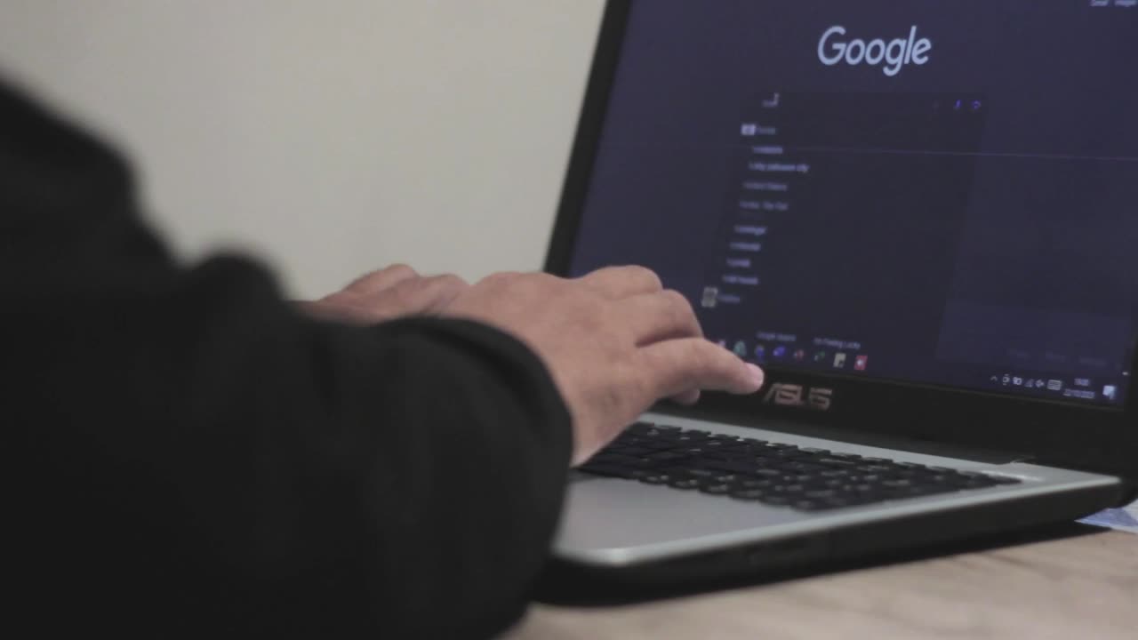 Working at a laptop on search results